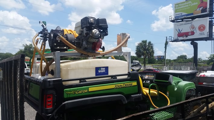 John Deere Gator with a mounted skid sprayer.jpg